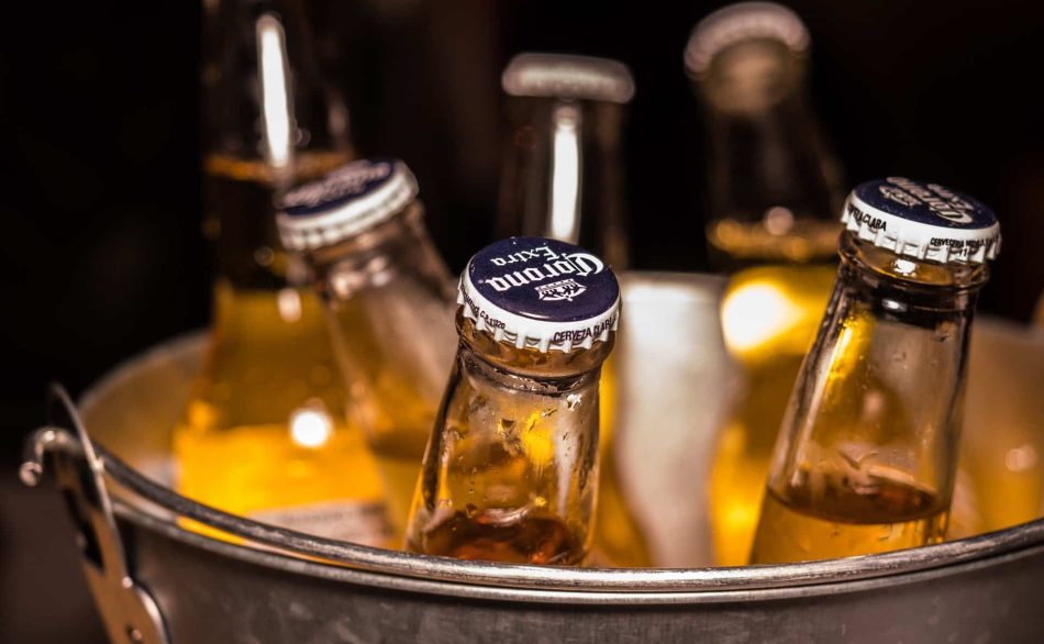 Bucket of Corona beers on ice.